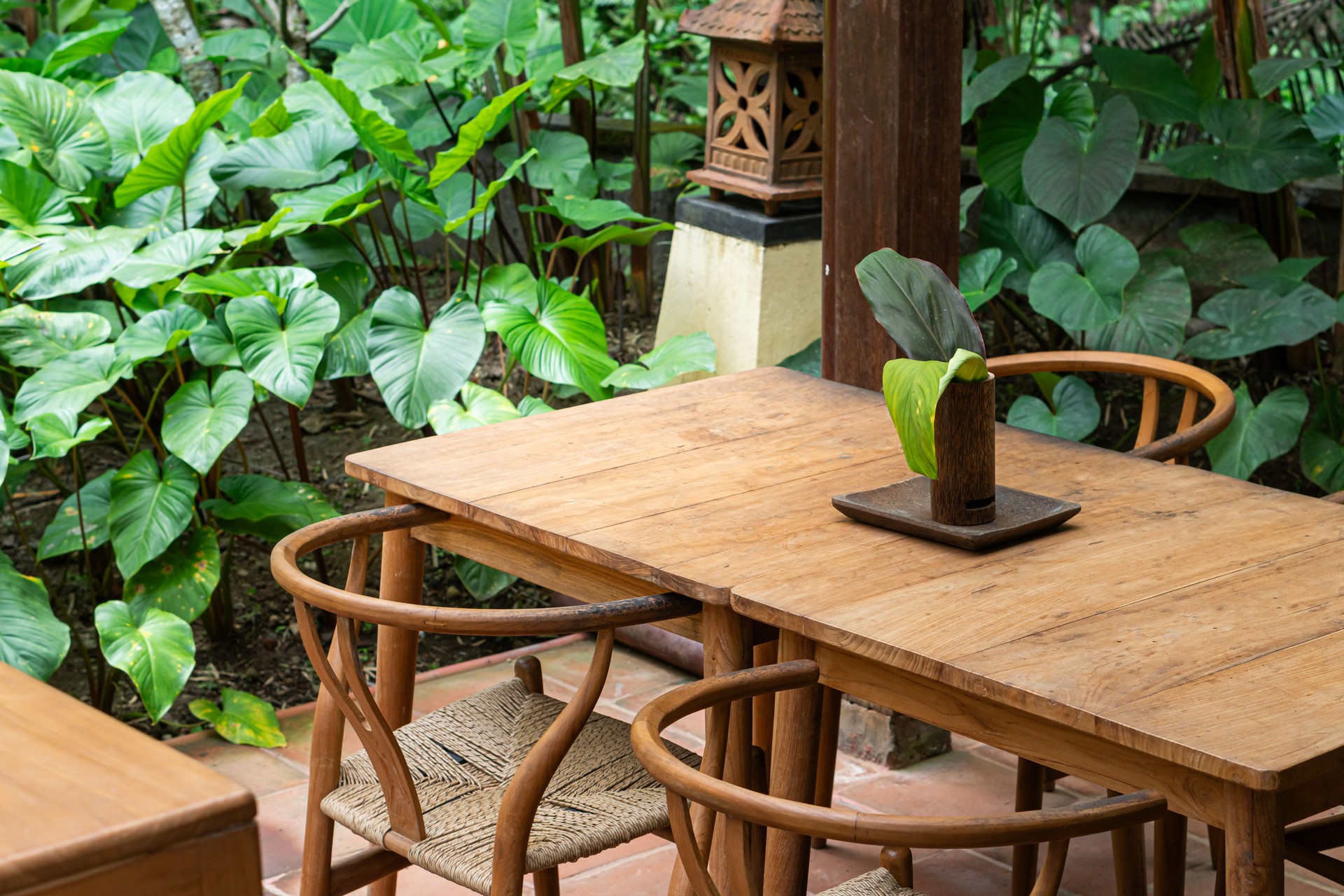 Serene Outdoor Dining Area Surrounded by Greenery