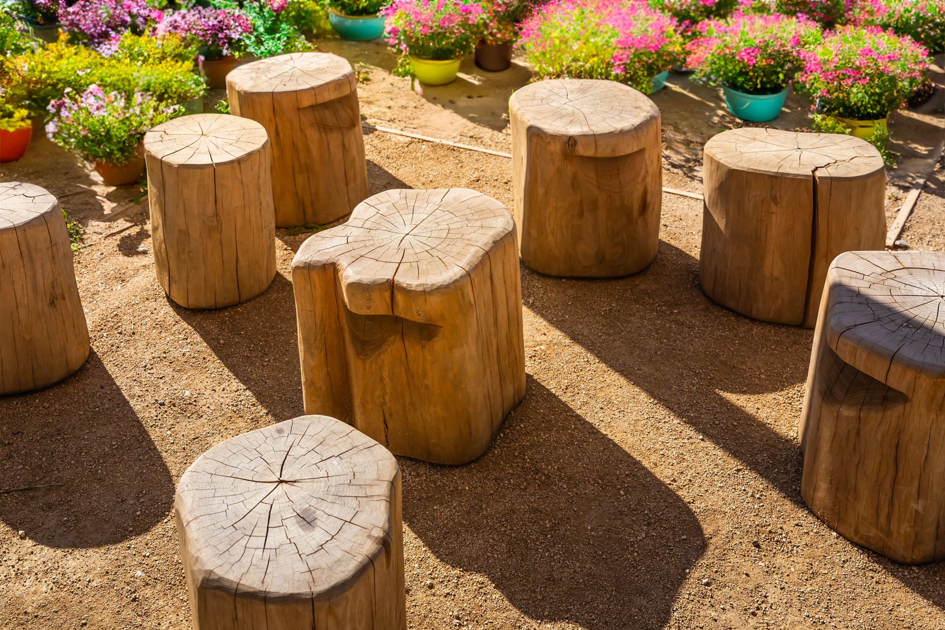 Cozy seating area in a garden or patio made from natural wooden logs